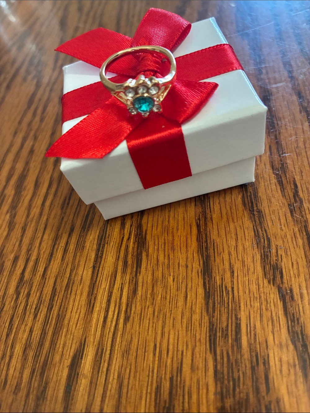 Elegant Gold Ring with Teal Gemstone and Clear Accents